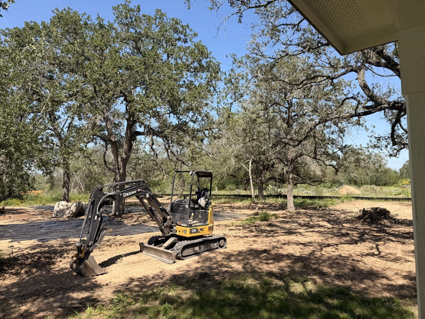 Excavator on a lot during site prep and cleanup